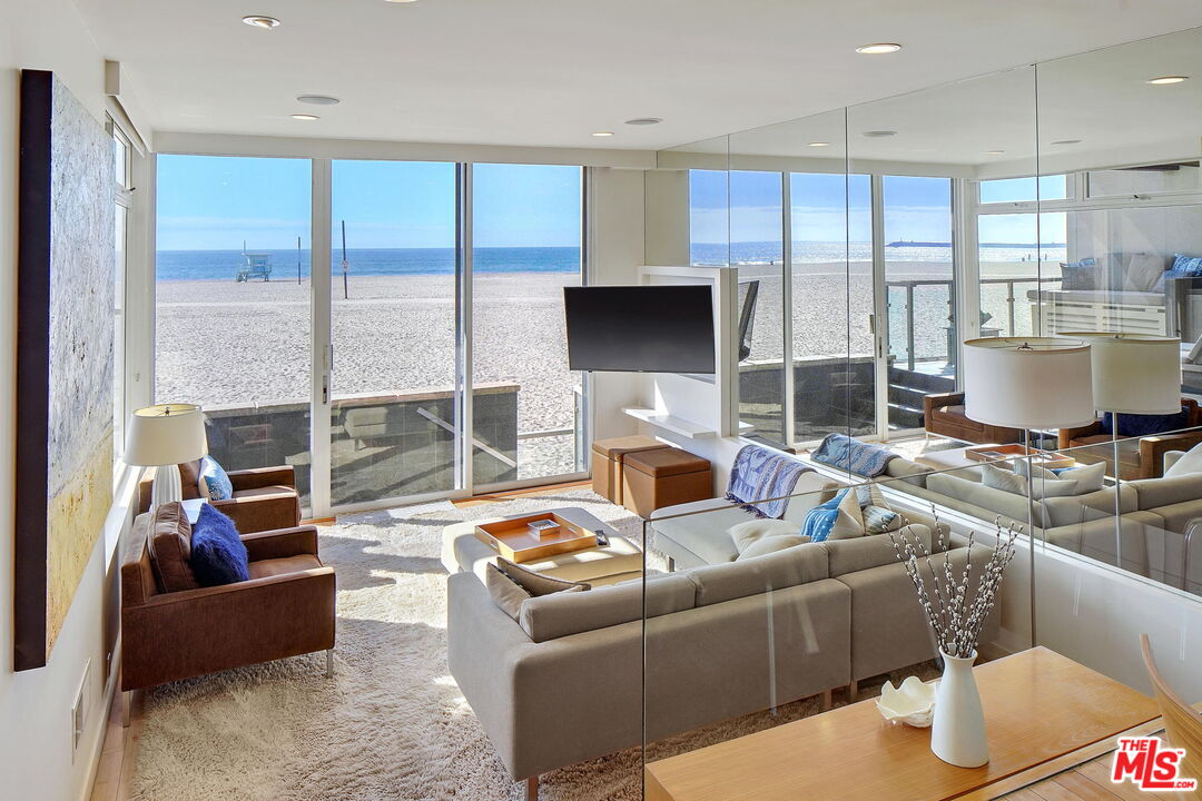 2 Ketch Street, Unit 102 Marina del Rey, CA 90292 - Photo 19 of 22 a living room with furniture and a fireplace