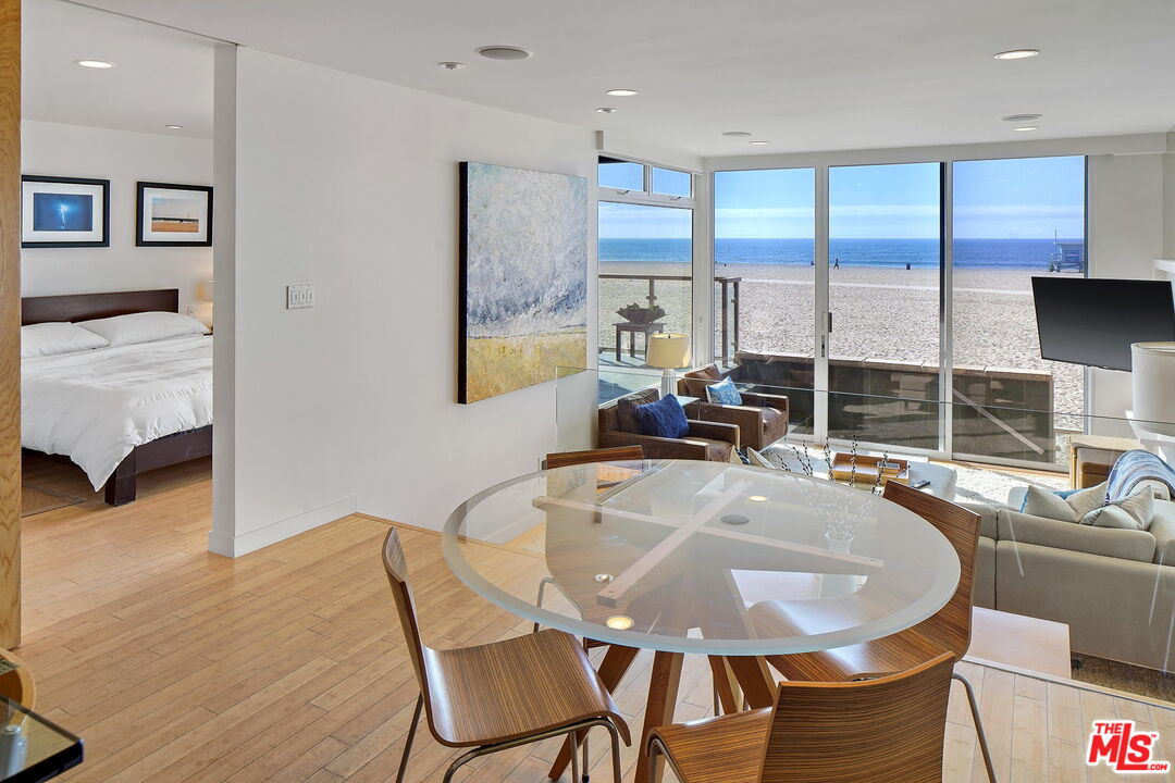 2 Ketch Street, Unit 102 Marina del Rey, CA 90292 - Photo 20 of 22 a dining room with furniture and a large window