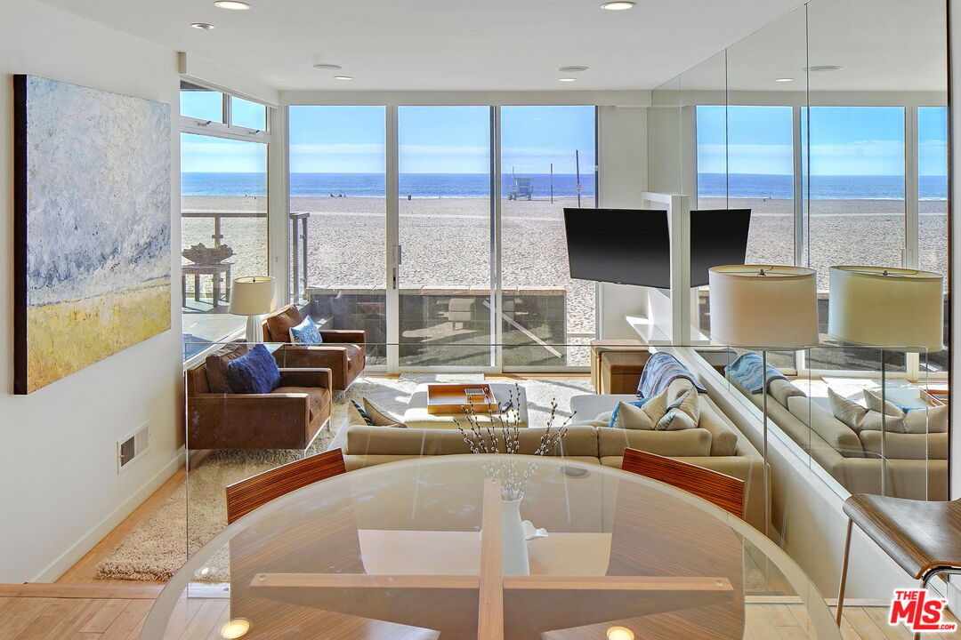 2 Ketch Street, Unit 102 Marina del Rey, CA 90292 - Photo 2 of 22 a living room with large window and a flat screen tv