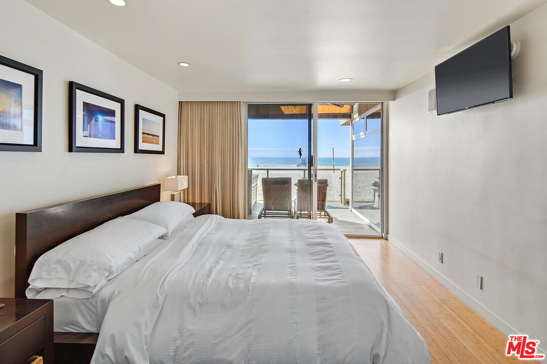 2 Ketch Street, Unit 102 Marina del Rey, CA 90292 - Photo 8 of 22 a spacious bedroom with a large bed and a flat screen tv