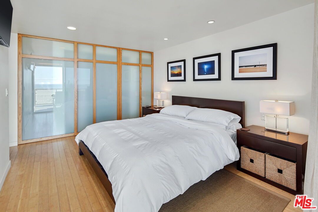 2 Ketch Street, Unit 102 Marina del Rey, CA 90292 - Photo 10 of 22 a bedroom with a bed and a night stand