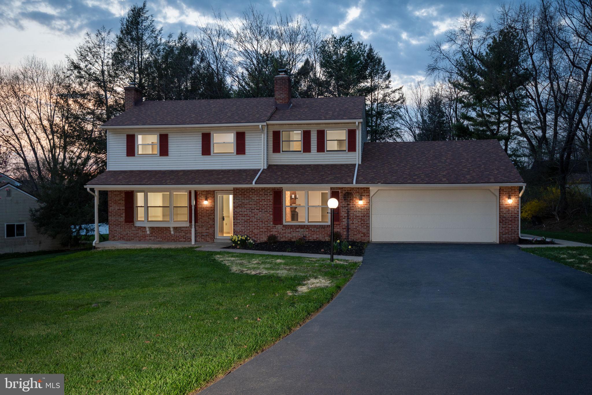 2348 Henbird Lane Lancaster, PA 17601 - Photo 1 of 58 a front view of a house with a yard and trees