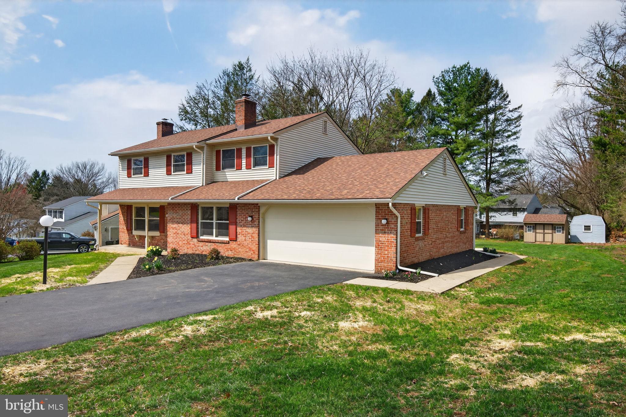 2348 Henbird Lane Lancaster, PA 17601 - Photo 4 of 58 a front view of a house with garden
