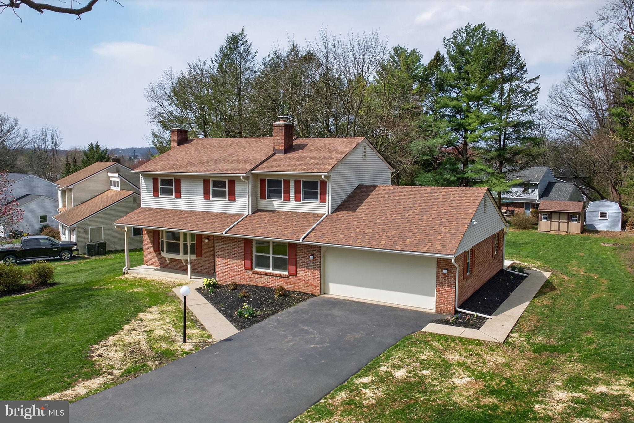 2348 Henbird Lane Lancaster, PA 17601 - Photo 42 of 58 a aerial view of a house with a yard table and chairs