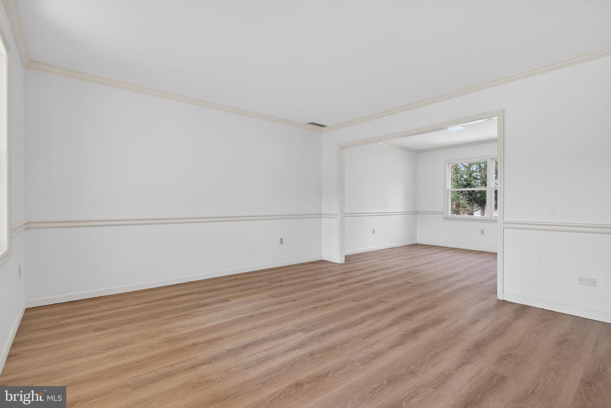 2348 Henbird Lane Lancaster, PA 17601 - Photo 8 of 58 an empty room with wooden floor and windows