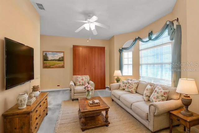 24088 Buckingham Way Punta Gorda, FL 33980 - Photo 12 of 37 a living room with furniture and a flat screen tv
