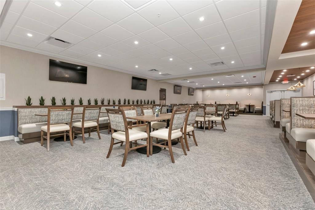 24088 Buckingham Way Punta Gorda, FL 33980 - Photo 27 of 37 a group of chairs sitting in a large room