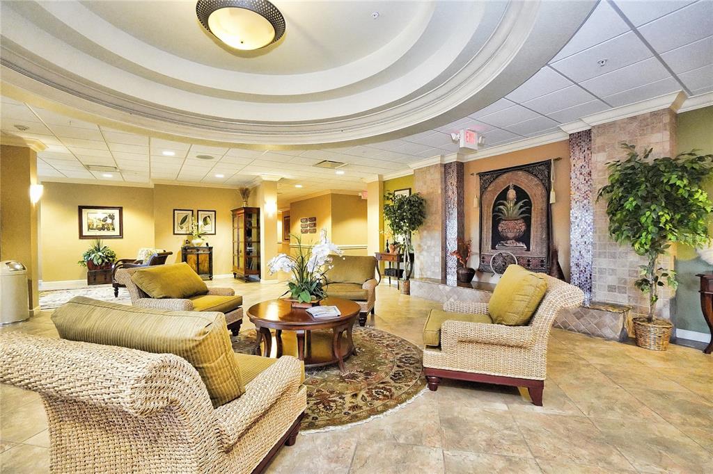 24088 Buckingham Way Punta Gorda, FL 33980 - Photo 31 of 37 a living room with furniture and a potted plant