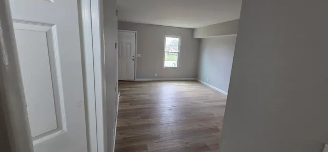 a view of livingroom with hardwood floor and window