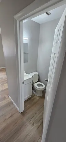 a bathroom with a toilet and a shower