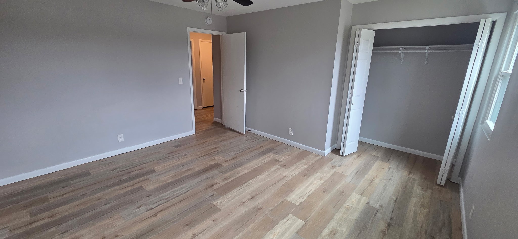 431 McClary Road, Unit B Smyrna, TN 37167 - Photo 9 of 11 a view of an empty room with wooden floor and a window