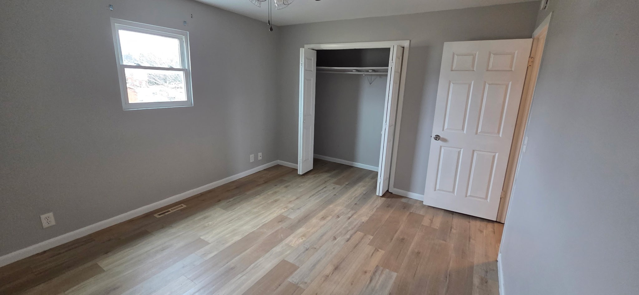 431 McClary Road, Unit B Smyrna, TN 37167 - Photo 10 of 11 an empty room with wooden floor and windows