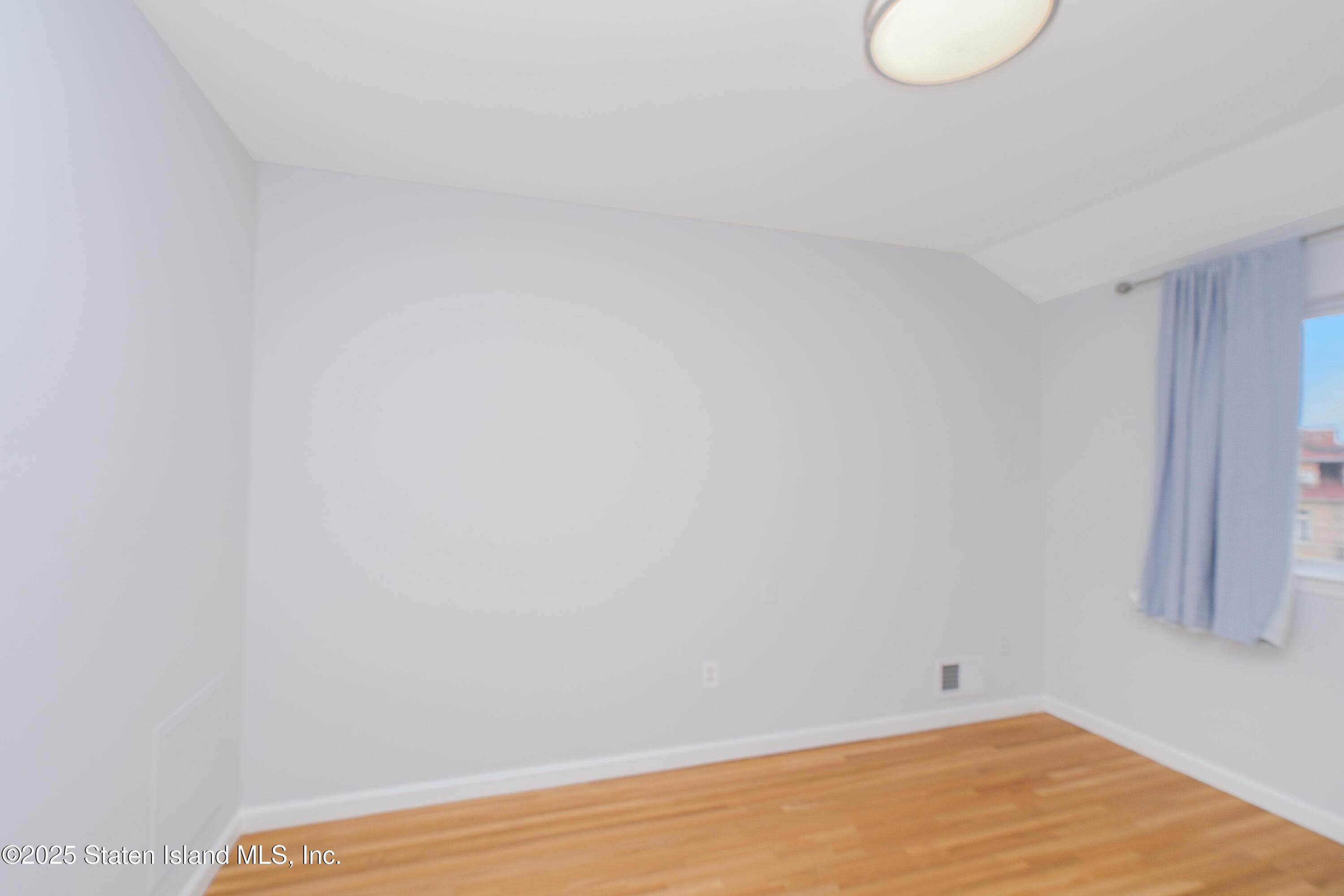 14 Ragazzi Lane Staten Island, NY 10305 - Photo 16 of 40 a view of a room with wooden floor