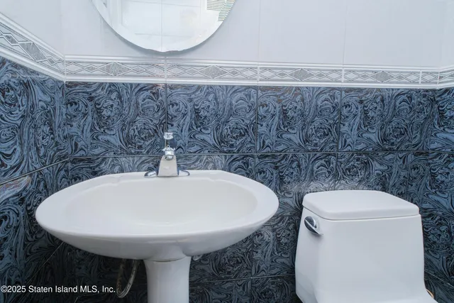 a bathroom with a toilet and a sink