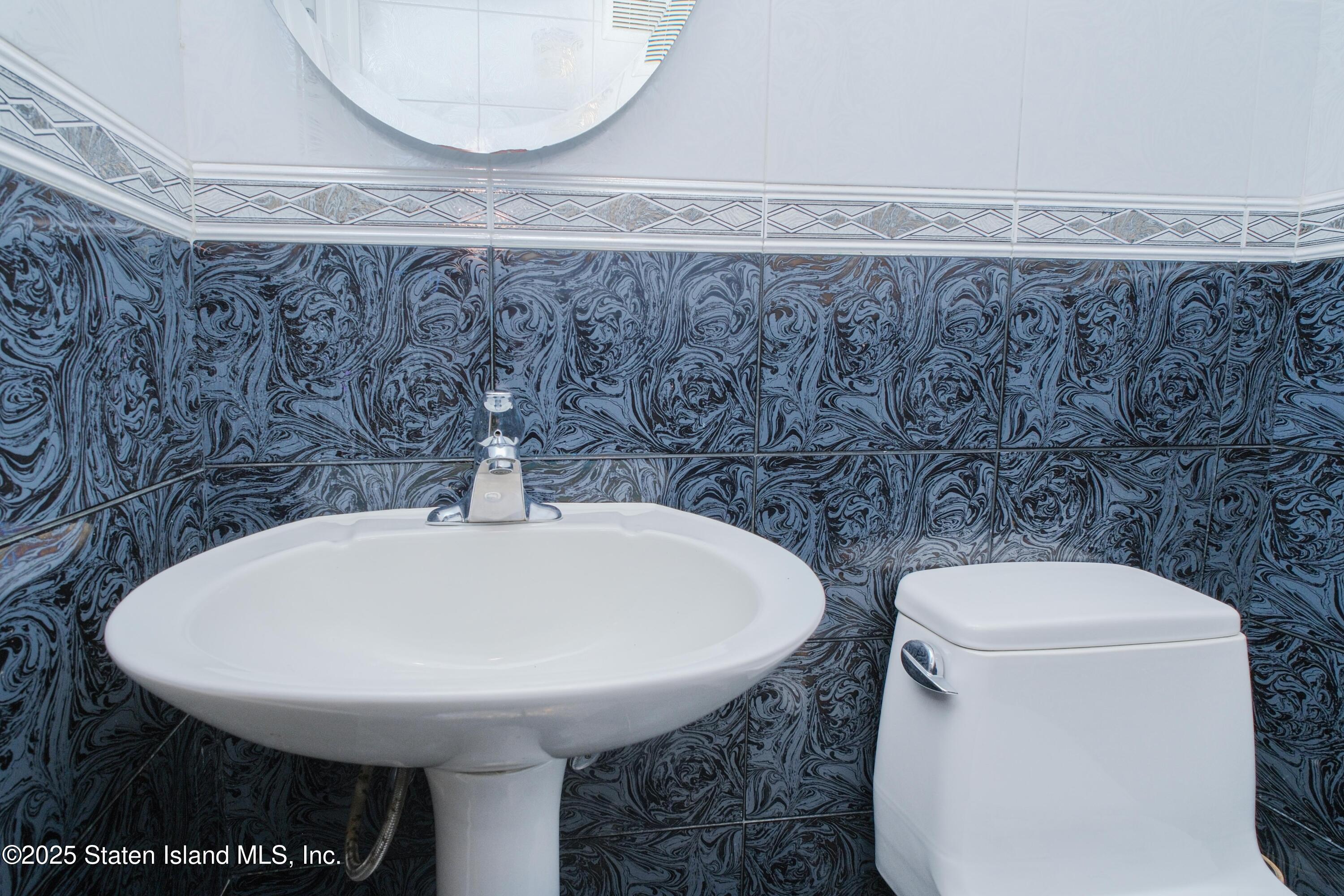 14 Ragazzi Lane Staten Island, NY 10305 - Photo 21 of 40 a bathroom with a toilet and a sink