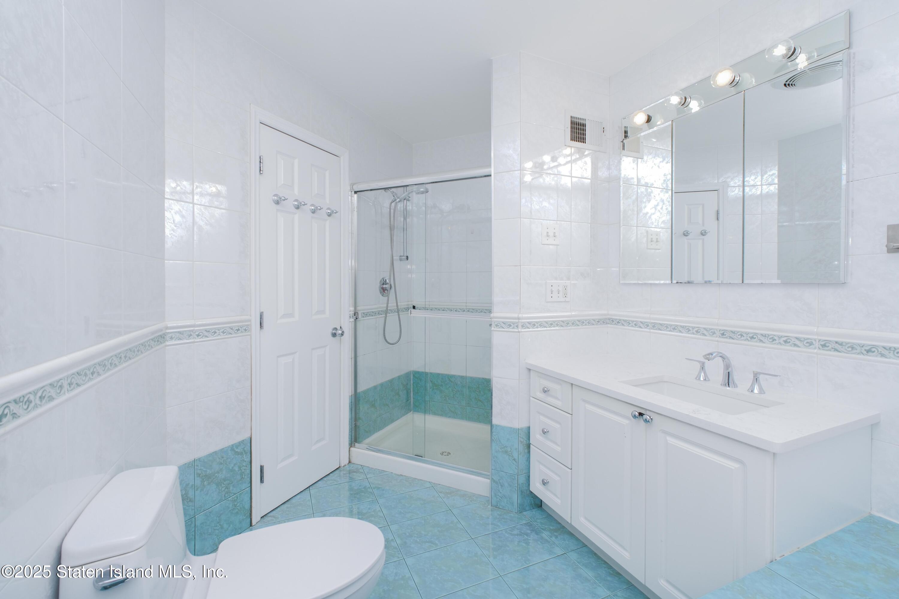 14 Ragazzi Lane Staten Island, NY 10305 - Photo 23 of 40 a bathroom with a sink toilet and shower