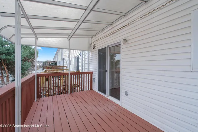a view of a patio with wooden floor