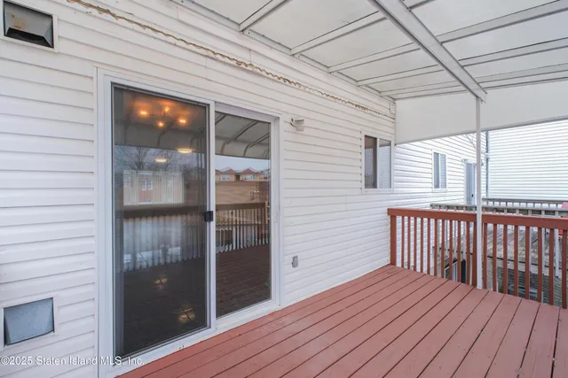 a view of outdoor space with wooden floor