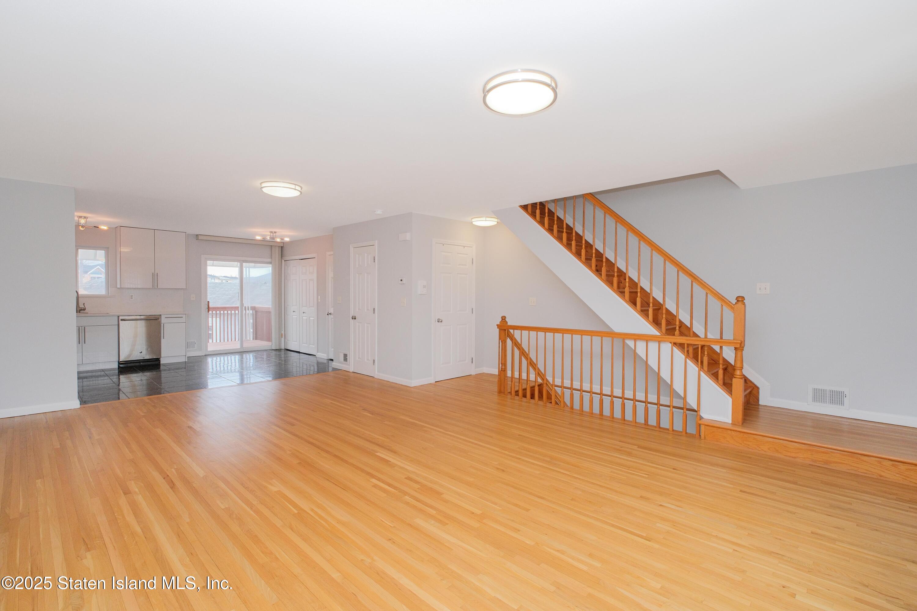 14 Ragazzi Lane Staten Island, NY 10305 - Photo 7 of 40 a view of an empty room with wooden floor