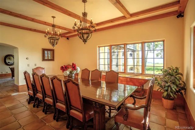 a kitchen with stainless steel appliances granite countertop a stove and a wooden floors