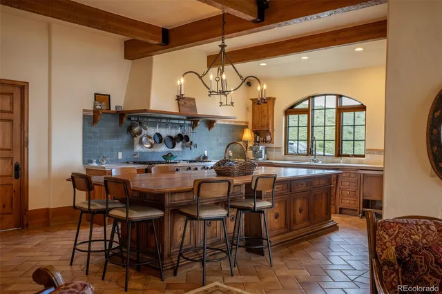 a kitchen with a stove and a sink