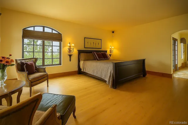 a view of a porch with a floor to ceiling window next to a yard