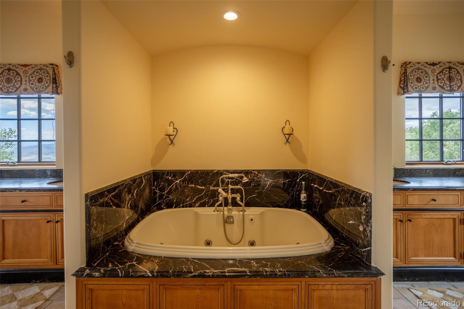 6903 Bellyache Ridge Road Wolcott, CO 81655 - Photo 27 of 50 a bathroom with a granite countertop sink and tub