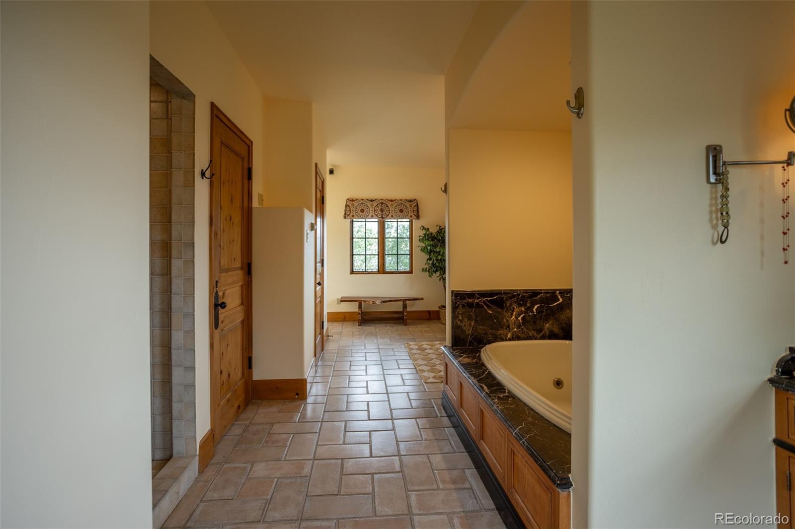 6903 Bellyache Ridge Road Wolcott, CO 81655 - Photo 28 of 50 a bathroom with a tub sink and mirror