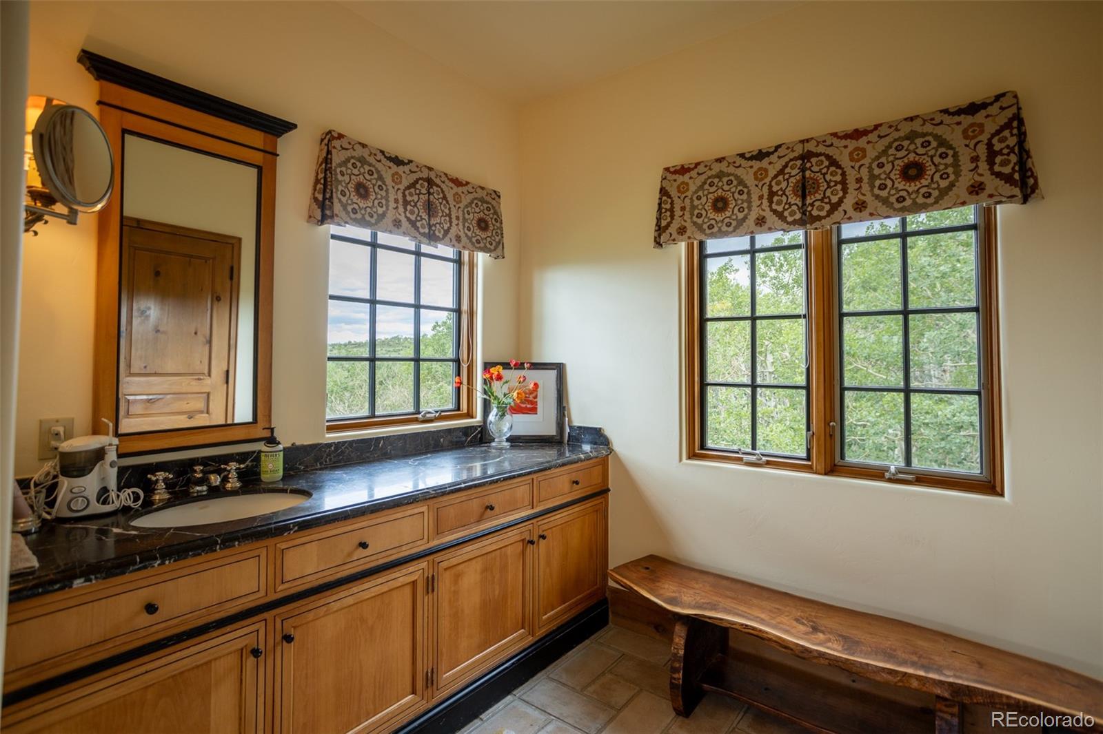 6903 Bellyache Ridge Road Wolcott, CO 81655 - Photo 30 of 50 a bathroom with a sink window and mirror