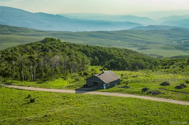 a view of a field with an ocean