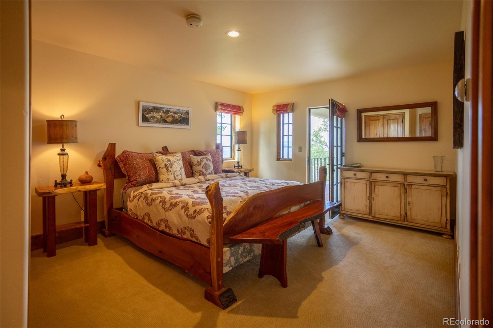 6903 Bellyache Ridge Road Wolcott, CO 81655 - Photo 38 of 50 a bedroom with a bed and a night stand