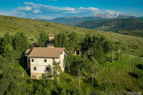 aerial view of a house with a yard