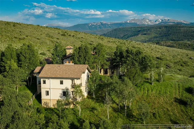 aerial view of a house with a yard
