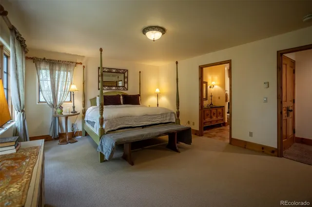 a spacious bathroom with a double vanity sink and a mirror