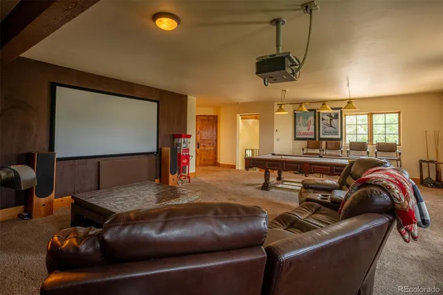 a room with pool table and a flat screen tv