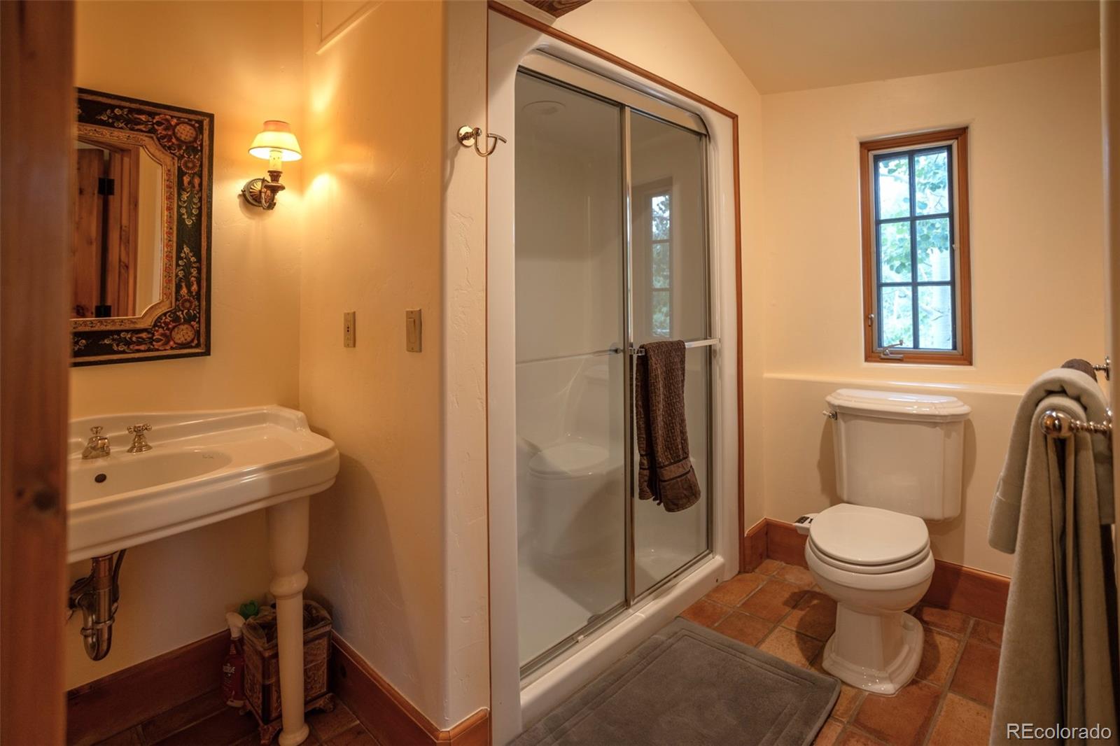 6903 Bellyache Ridge Road Wolcott, CO 81655 - Photo 45 of 50 a bathroom with a toilet a sink and a shower