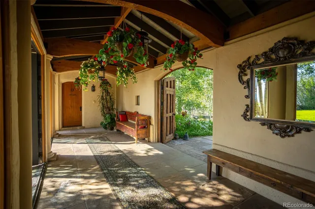a view of a porch with wooden floor and outdoor space