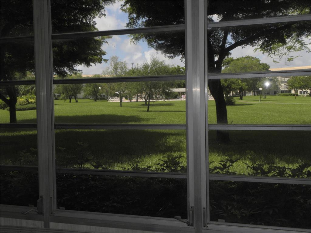 1605 Abaco Drive, Unit 1605 J1 Coconut Creek, FL 33066 - Photo 12 of 71 a view of a lake from a living room