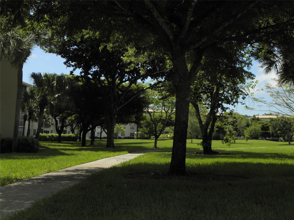 1605 Abaco Drive, Unit 1605 J1 Coconut Creek, FL 33066 - Photo 14 of 71 a park with lots of trees and plants