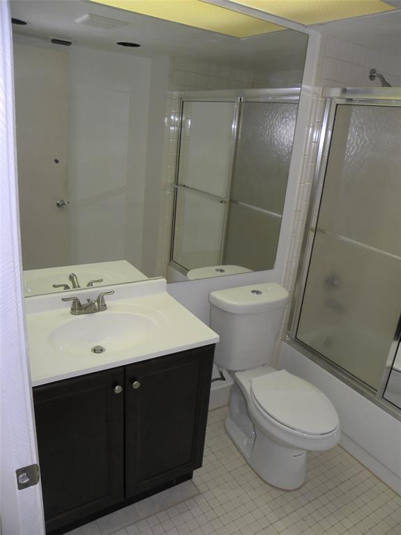 1605 Abaco Drive, Unit 1605 J1 Coconut Creek, FL 33066 - Photo 15 of 71 a bathroom with a sink toilet and shower