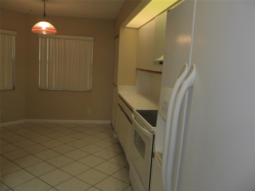 1605 Abaco Drive, Unit 1605 J1 Coconut Creek, FL 33066 - Photo 17 of 71 a bathroom with a sink and a mirror
