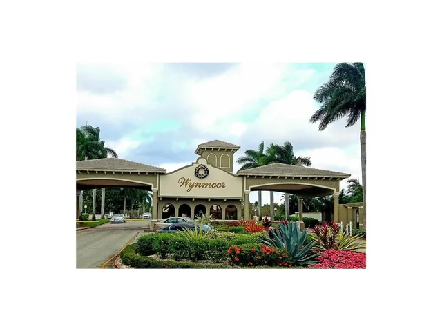 a hallway with a chair and wooden floor