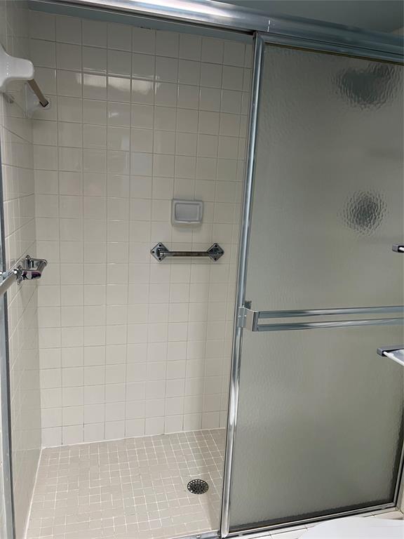 1605 Abaco Drive, Unit 1605 J1 Coconut Creek, FL 33066 - Photo 26 of 71 a bathroom with a glass shower door