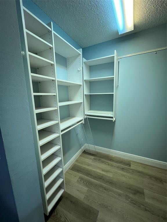 1605 Abaco Drive, Unit 1605 J1 Coconut Creek, FL 33066 - Photo 33 of 71 a view of walk in closet with empty racks