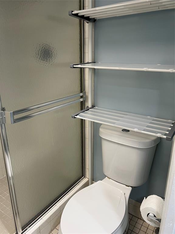 1605 Abaco Drive, Unit 1605 J1 Coconut Creek, FL 33066 - Photo 34 of 71 a white toilet sitting next to a shower