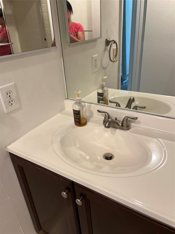 1605 Abaco Drive, Unit 1605 J1 Coconut Creek, FL 33066 - Photo 44 of 71 a bathroom with a sink and a mirror