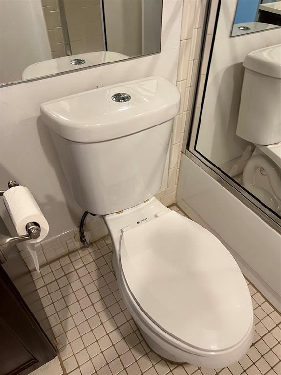 1605 Abaco Drive, Unit 1605 J1 Coconut Creek, FL 33066 - Photo 46 of 71 a bathroom with a toilet and a mirror