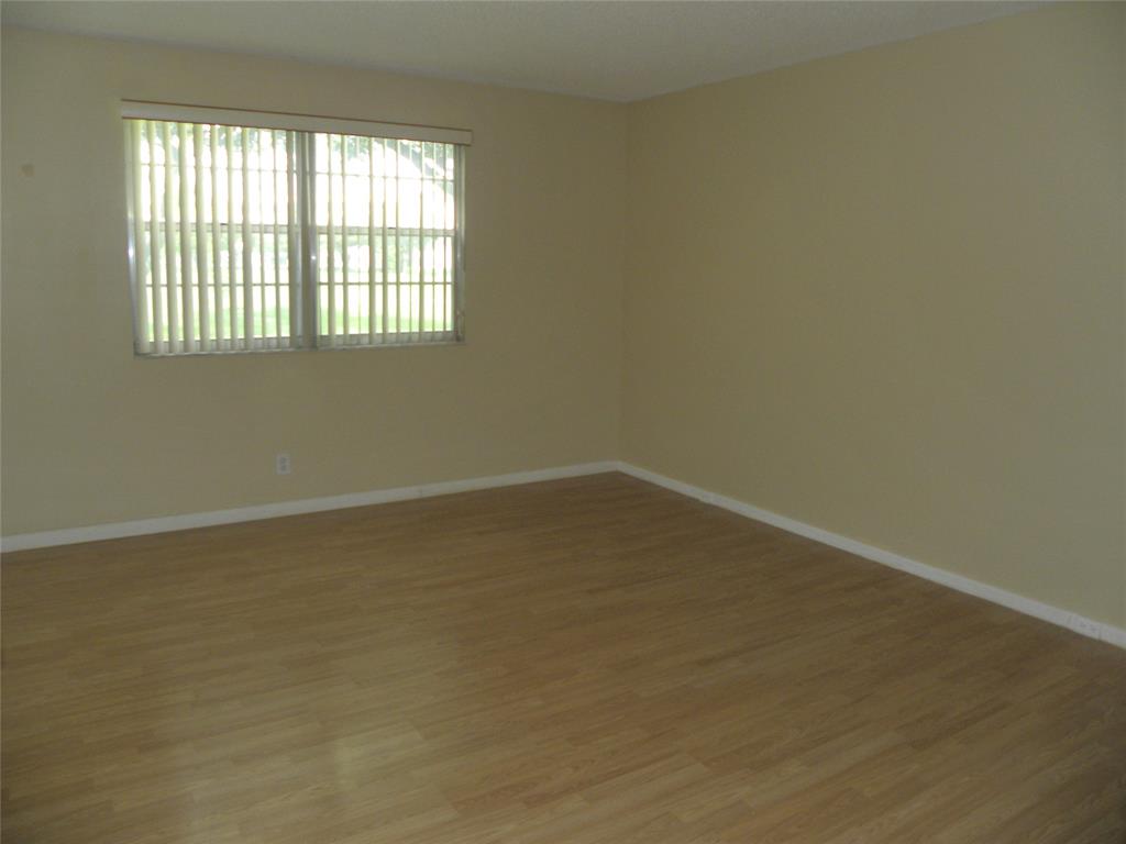 1605 Abaco Drive, Unit 1605 J1 Coconut Creek, FL 33066 - Photo 5 of 71 an empty room with a window