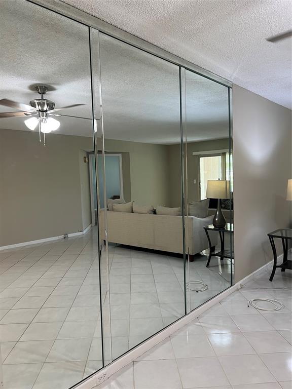1605 Abaco Drive, Unit 1605 J1 Coconut Creek, FL 33066 - Photo 65 of 71 a view of a livingroom with a furniture and chandelier fan