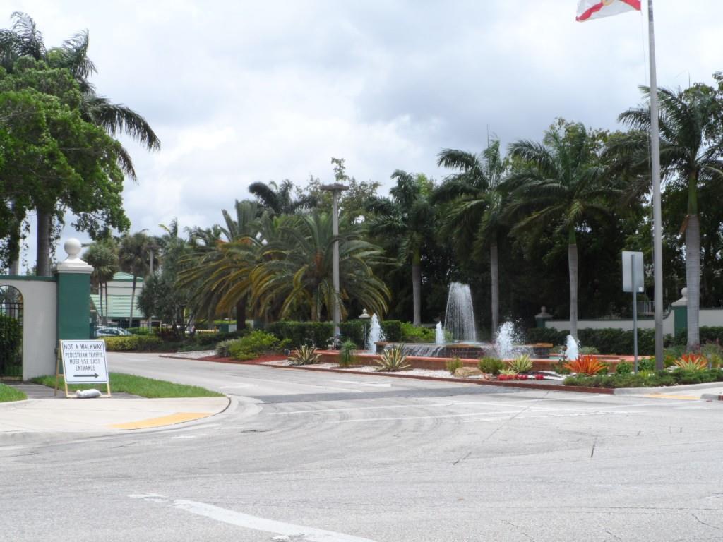 1605 Abaco Drive, Unit 1605 J1 Coconut Creek, FL 33066 - Photo 10 of 71 a view of a fountain with palm trees